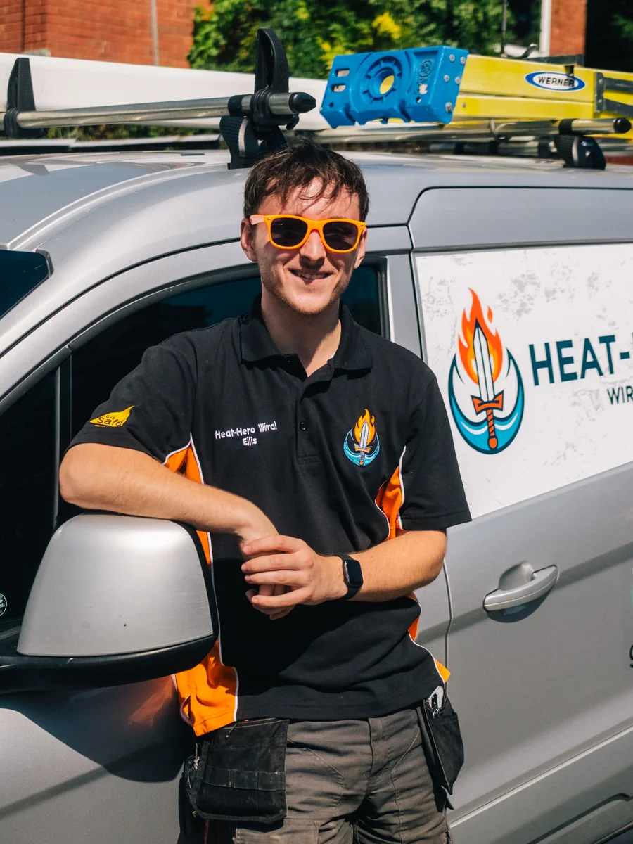 Ellis, Heat Hero Wirral, beside his liveried van